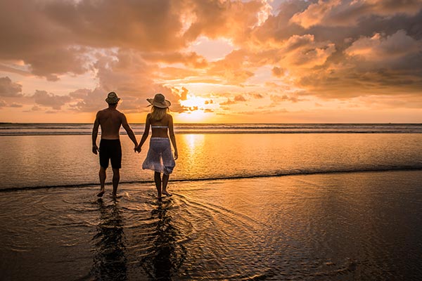 couple walking in costa rica sunset